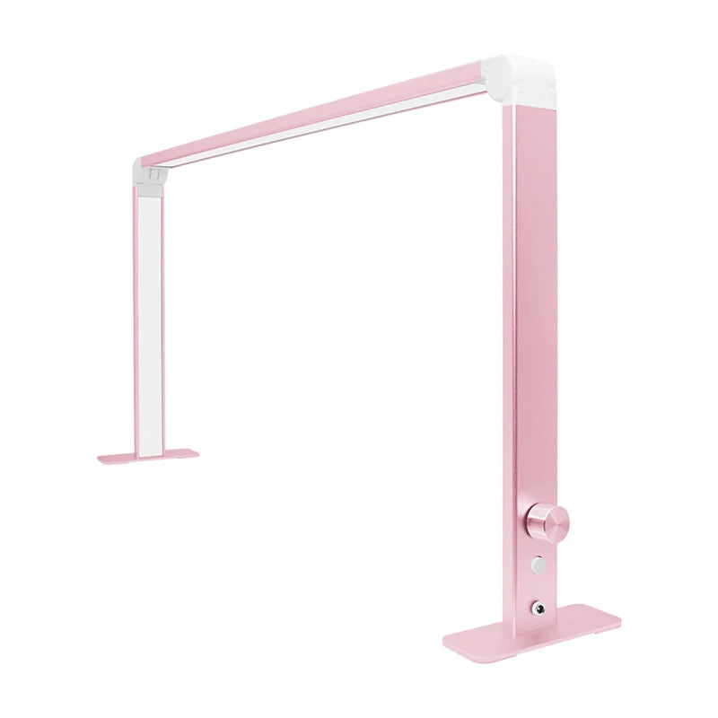 Pink foldable LED nail desk lamp, unfolded and switched on