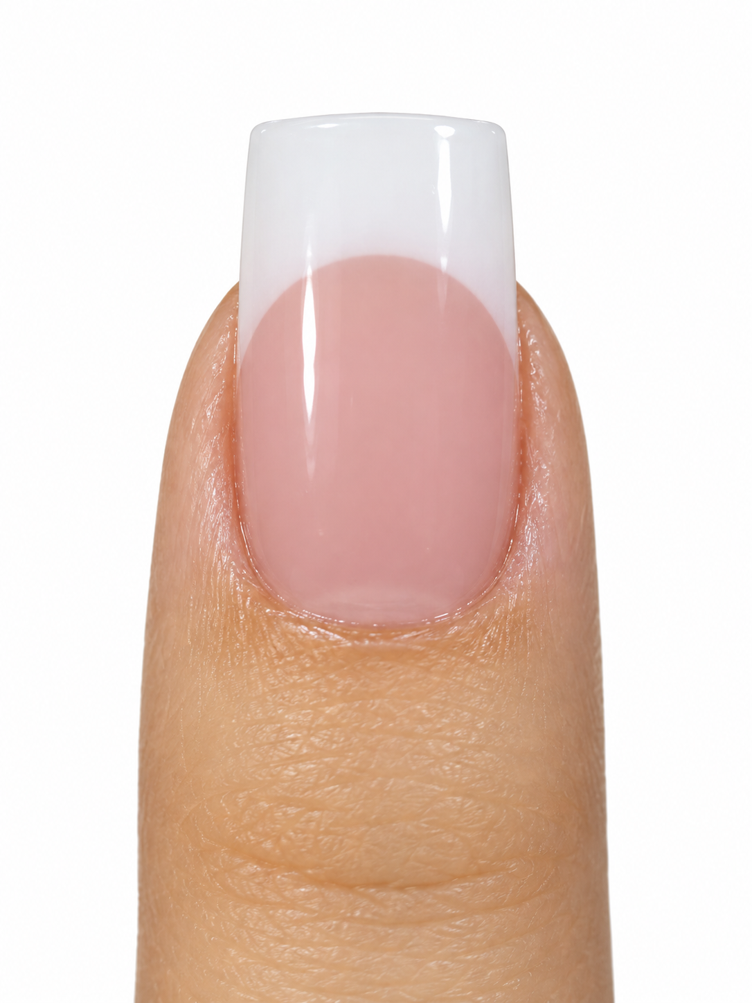 Close-up of a square French nail with a cool pink nail bed and white tip on a white background
